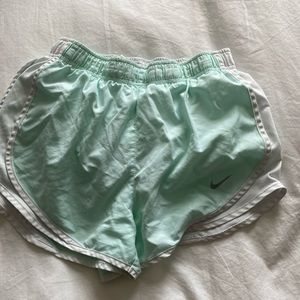 Mint green and white Nike shorts